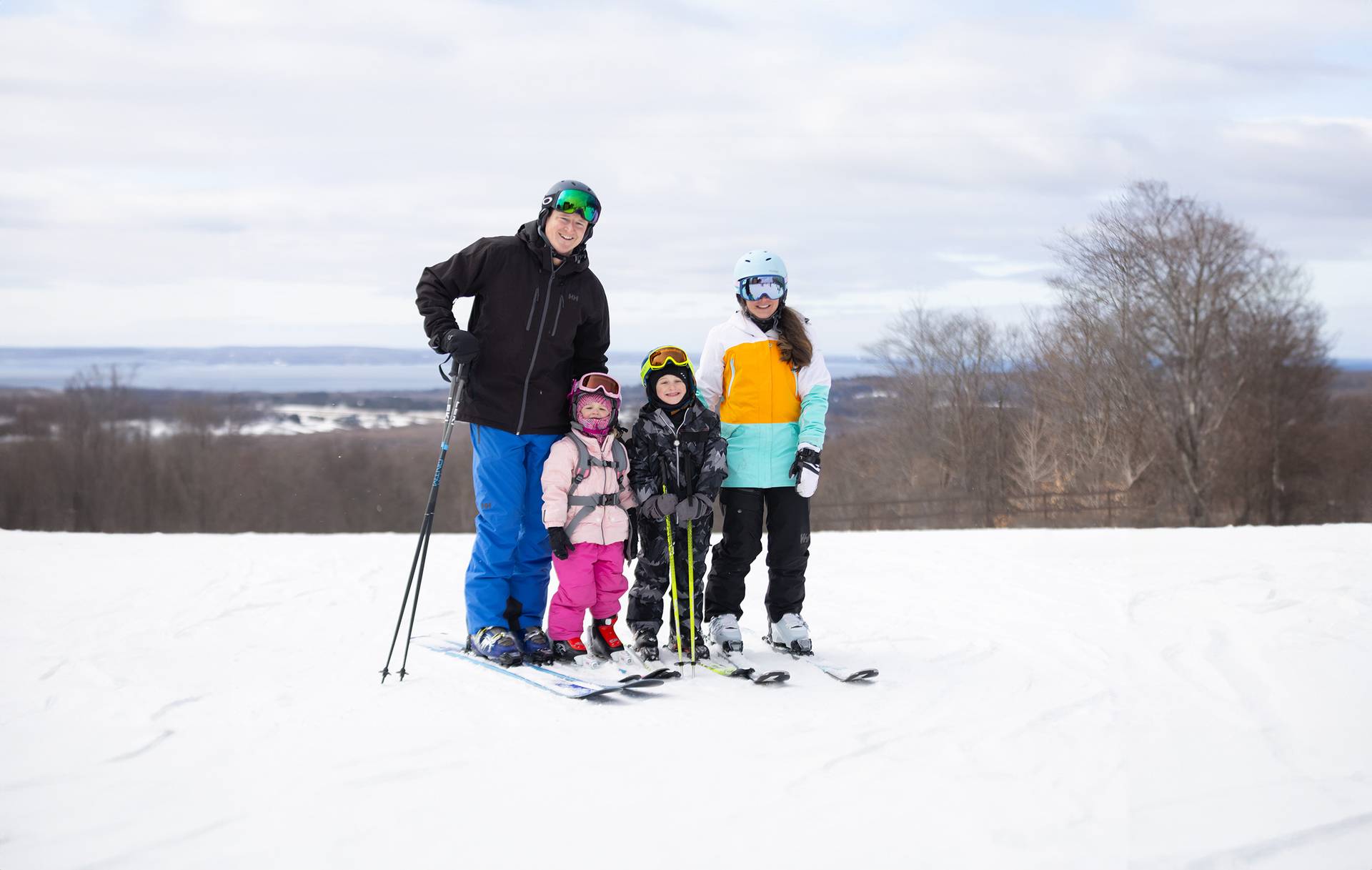 A family in ski gear posing