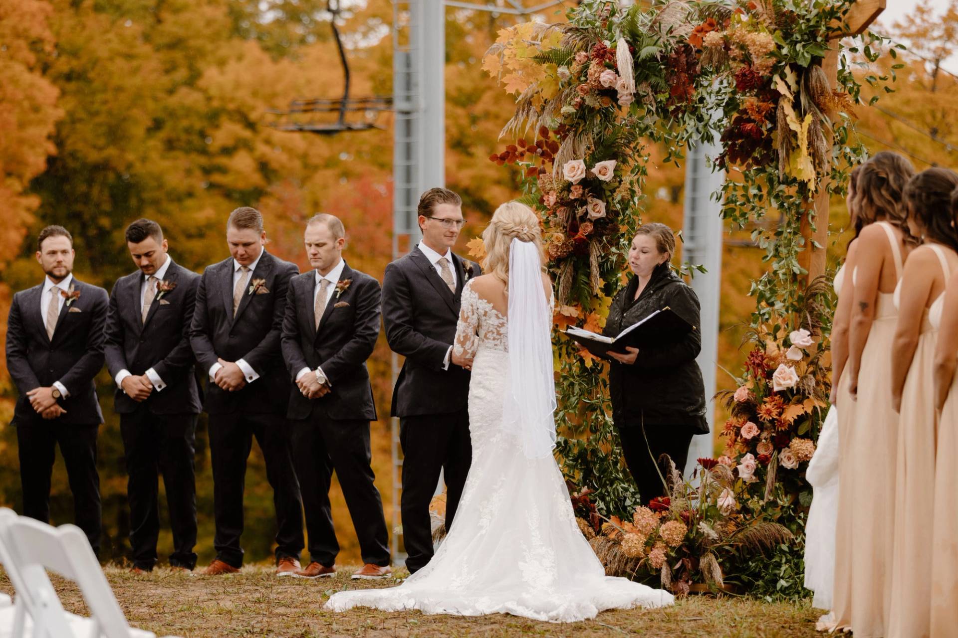 A wedding near a chairlift in fall