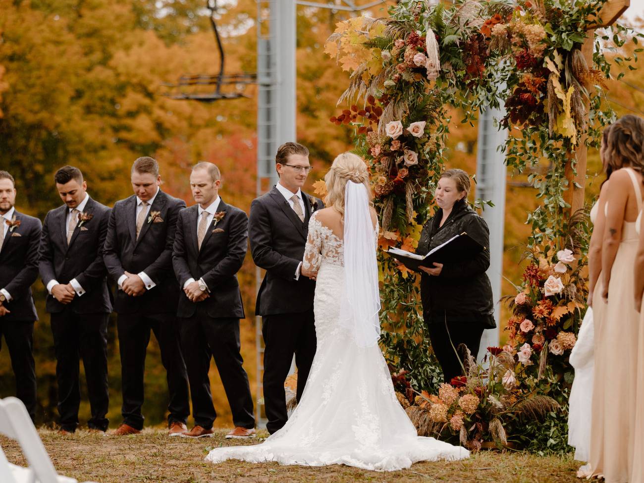 A wedding near a chairlift in fall