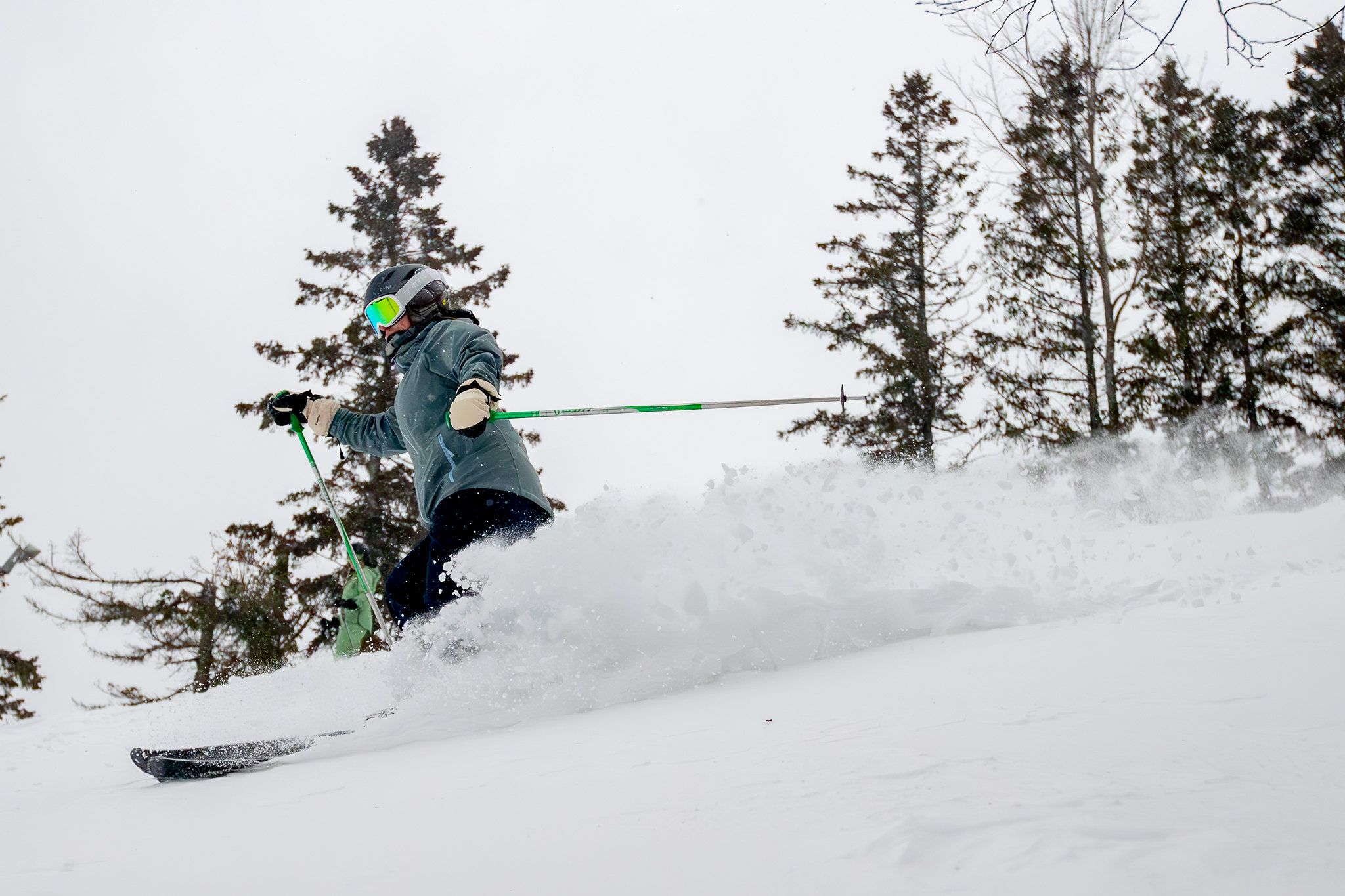A skier in deep powder at The Highlands