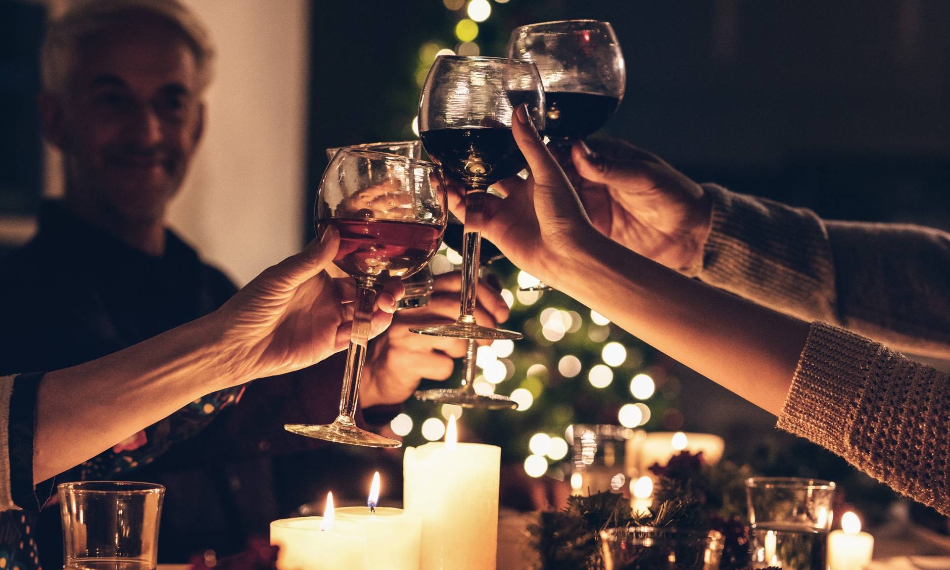 a group cheering with wine.