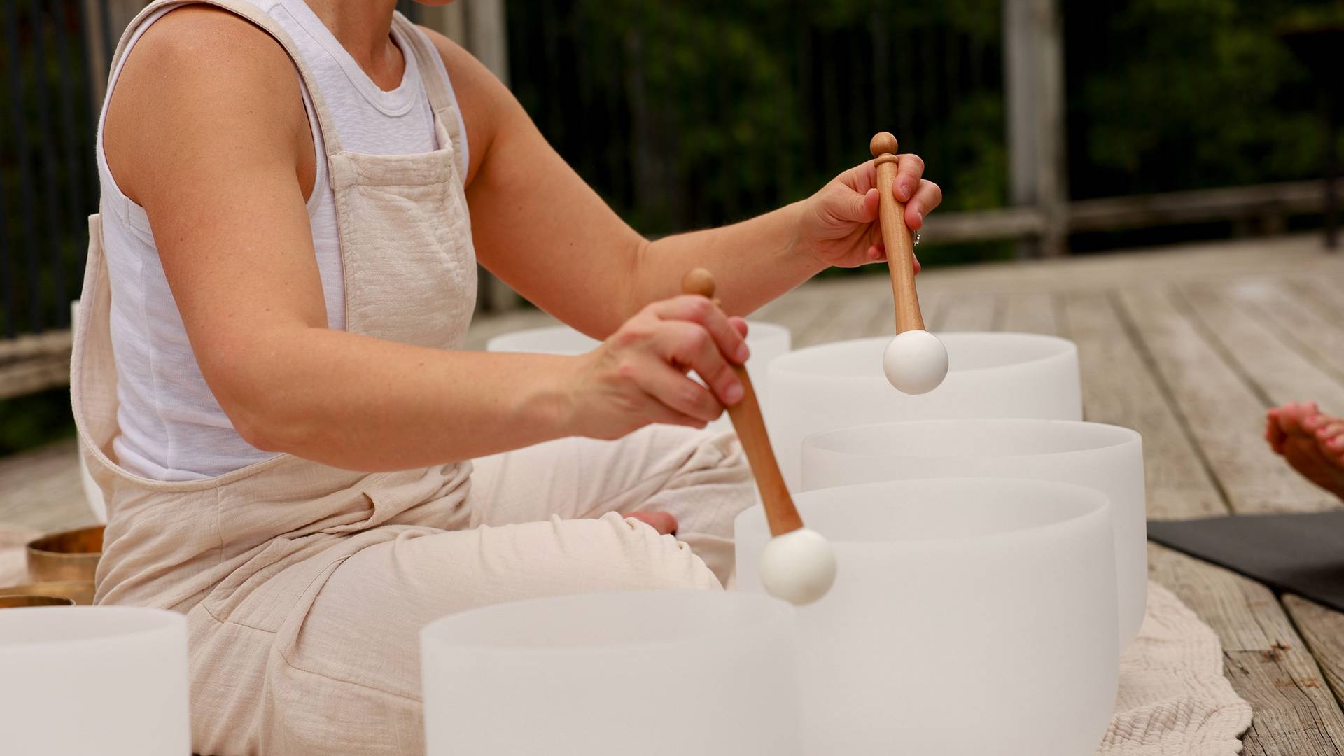A close up of quartz bowls during a sound bath