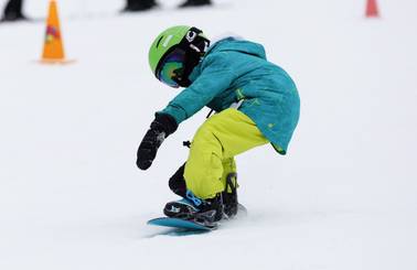 A child snowboarding
