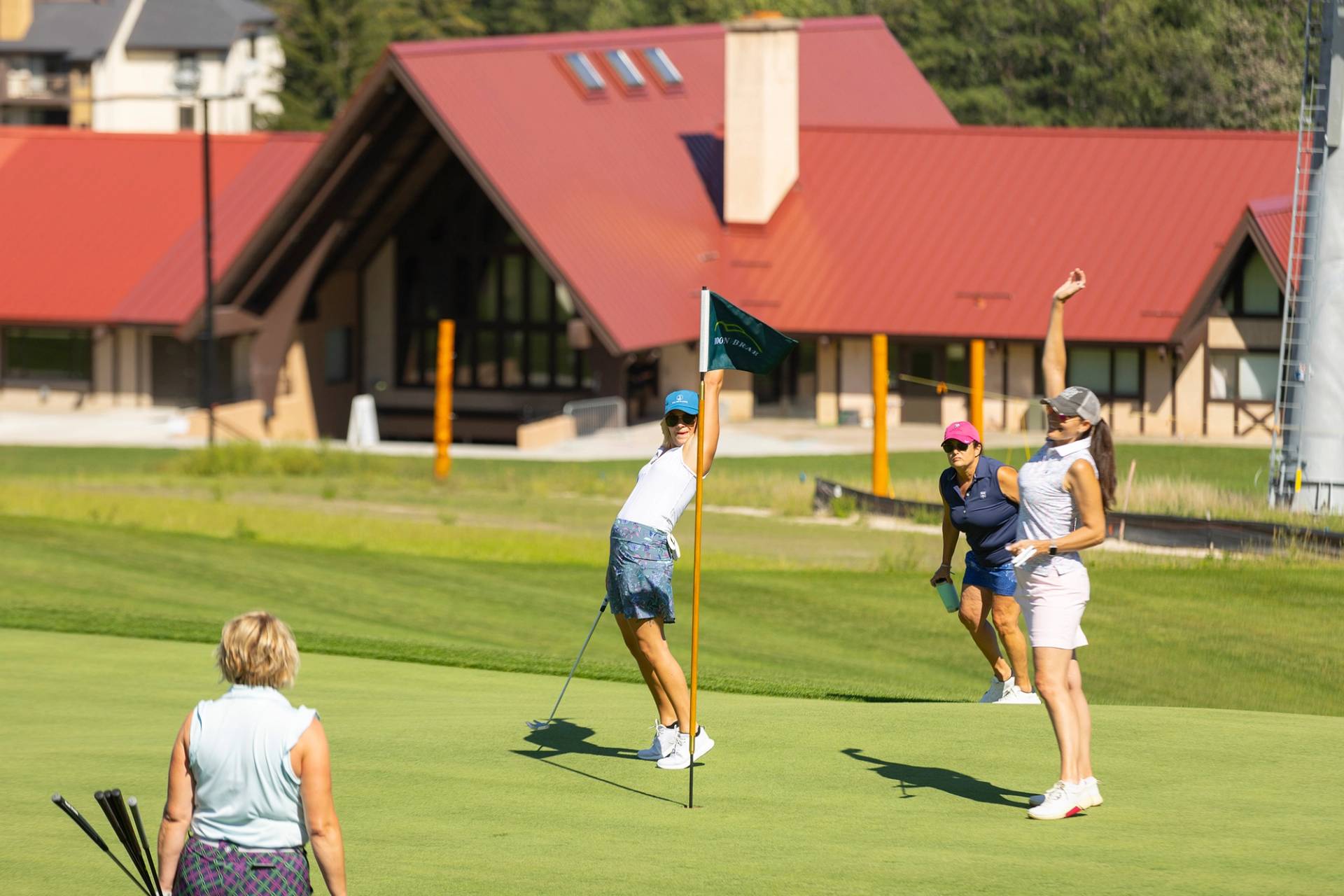A group o women cheering while golfing Doon Brae
