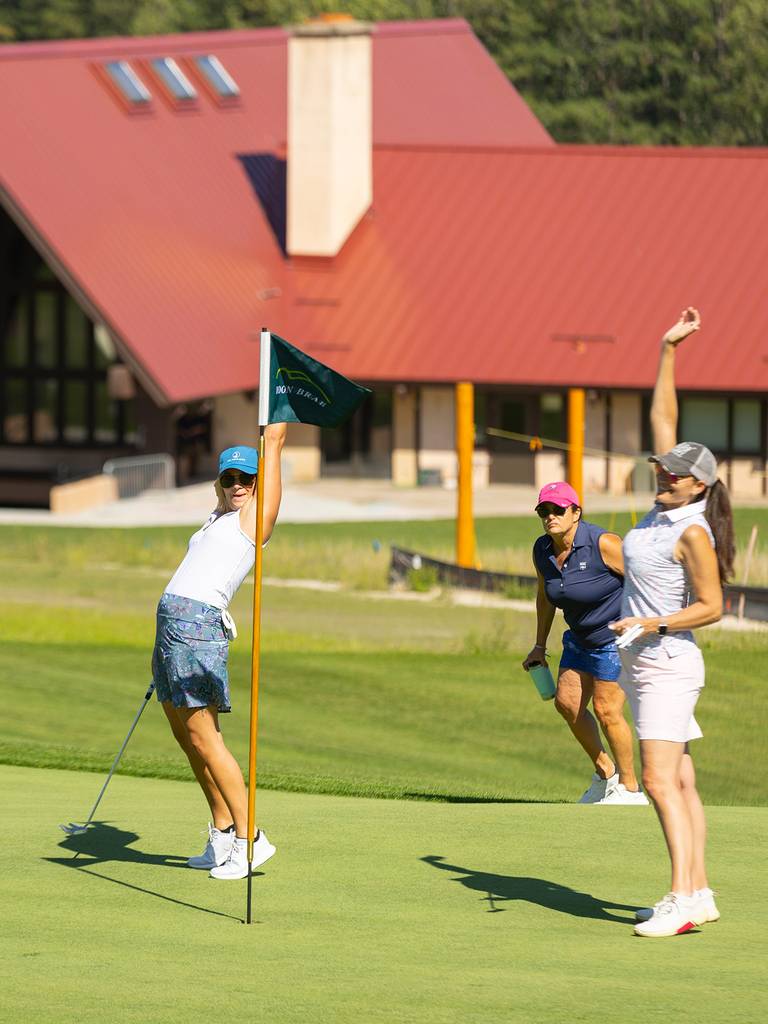 A group o women cheering while golfing Doon Brae