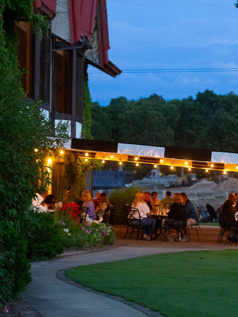 The Slopeside Lounge patio in the summer at The Highlands