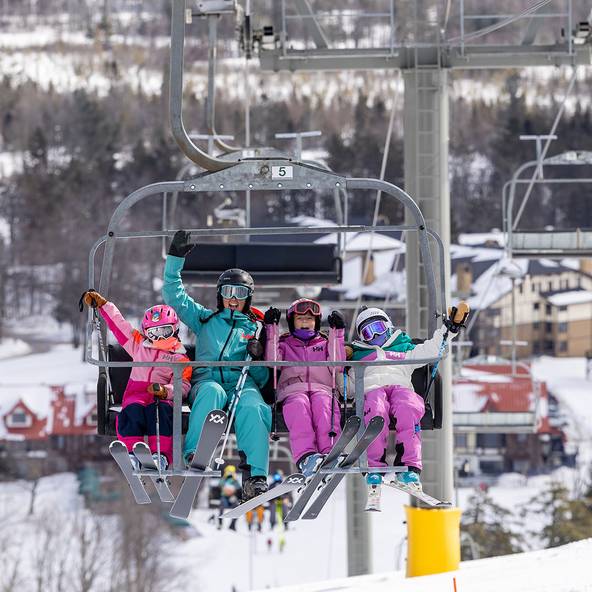 A family on the chairlift at The Highlands