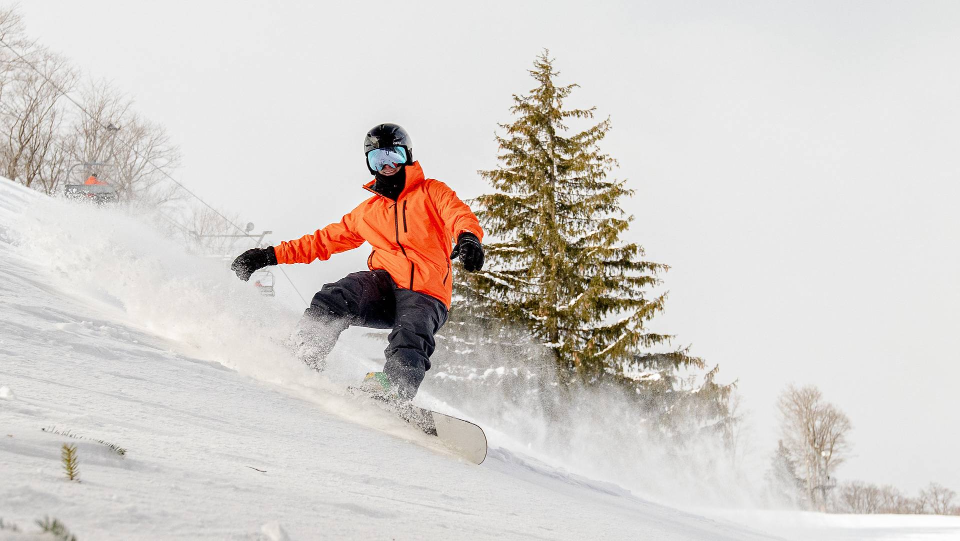 A man snowboarding at The Highlands