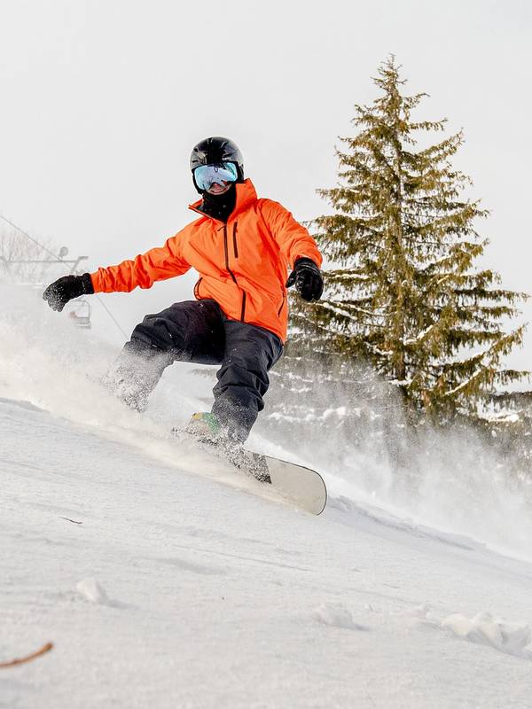 A man snowboarding at The Highlands
