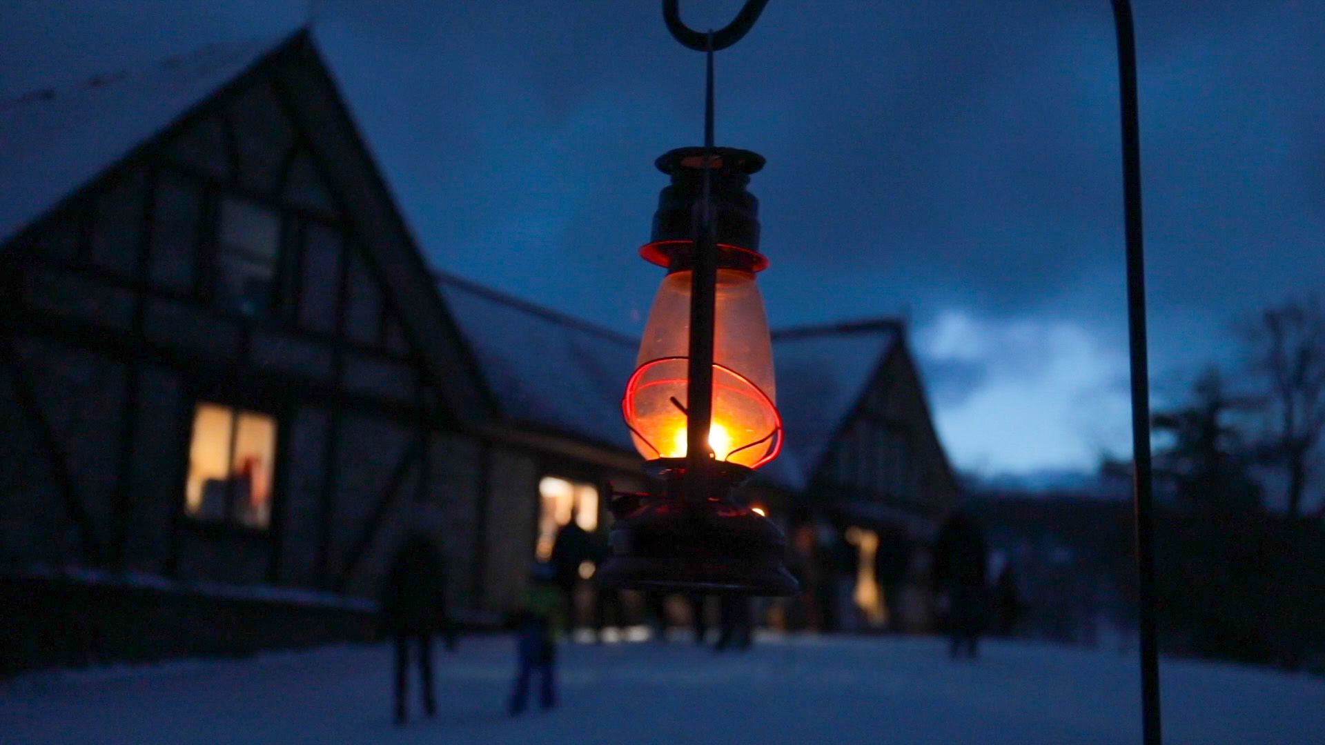 A closeup of a lantern lit up at night