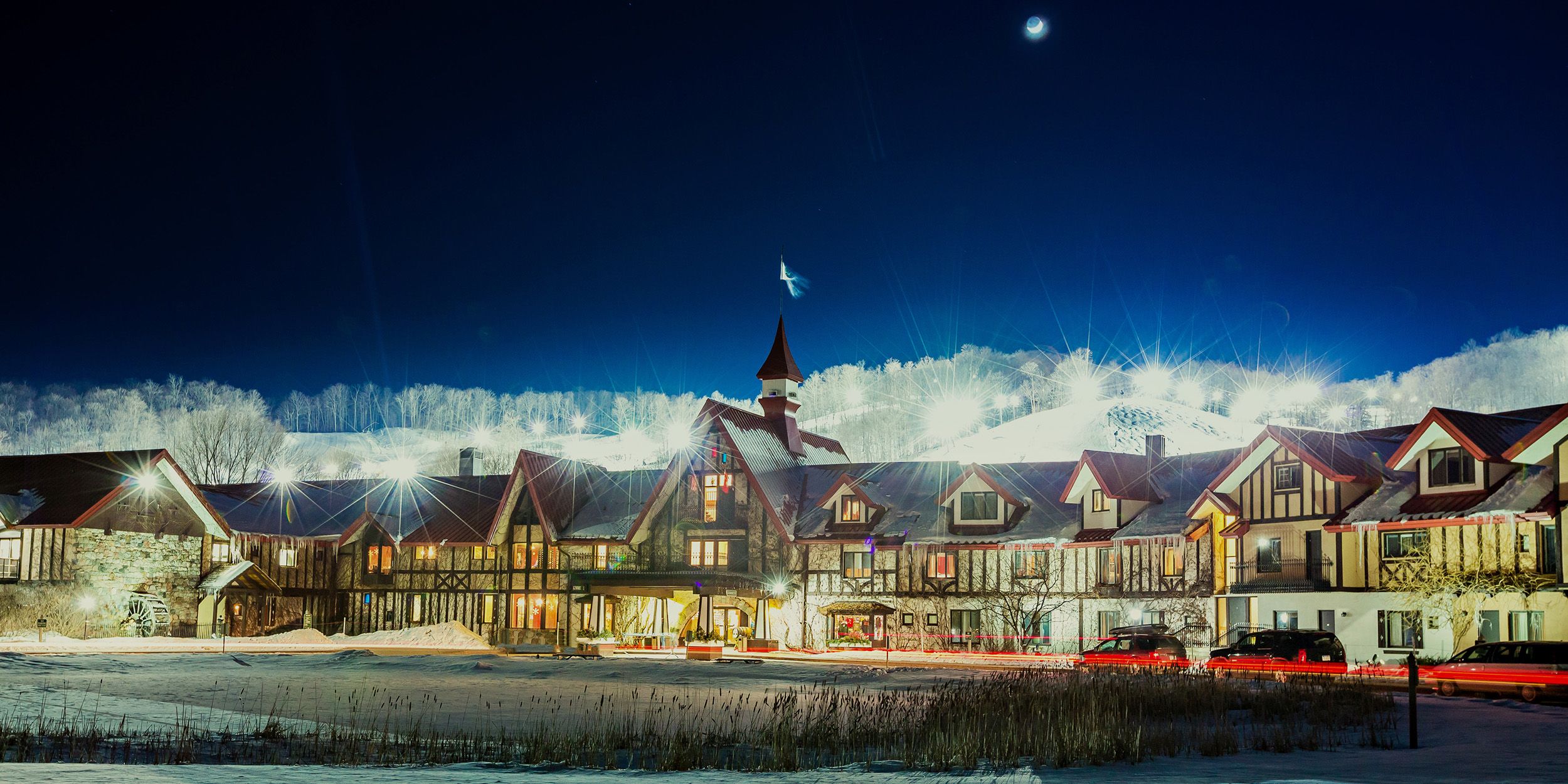 The Main Lodge exterior in winter at night