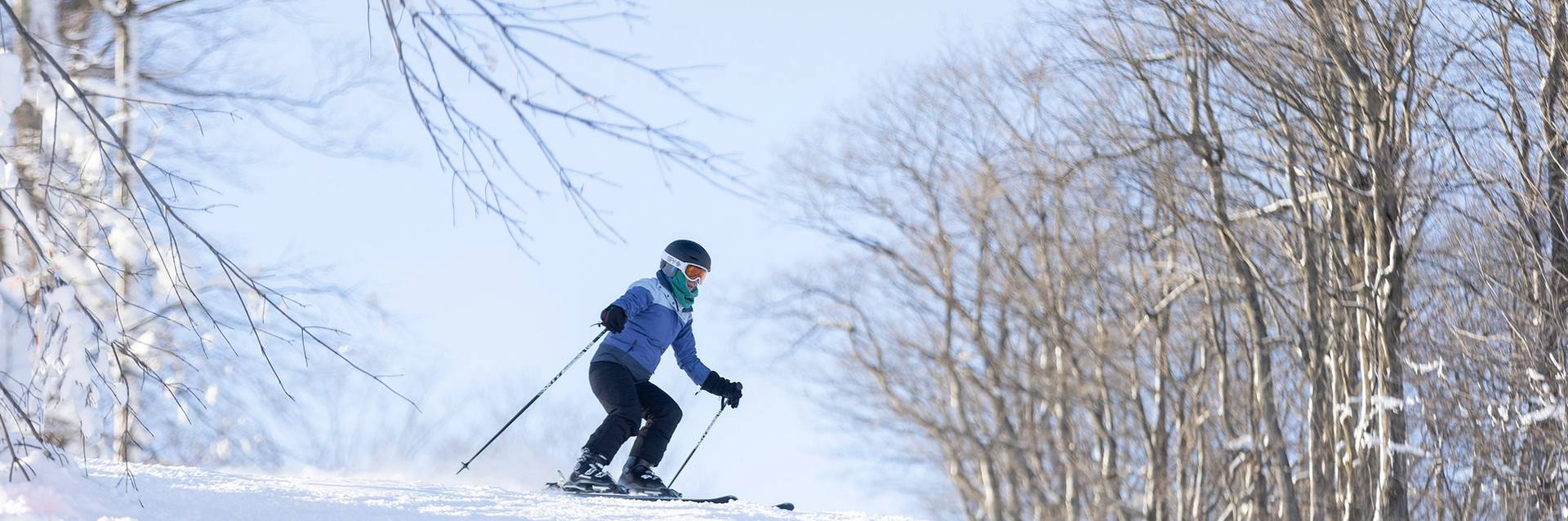 A woman skiing at The Highlands
