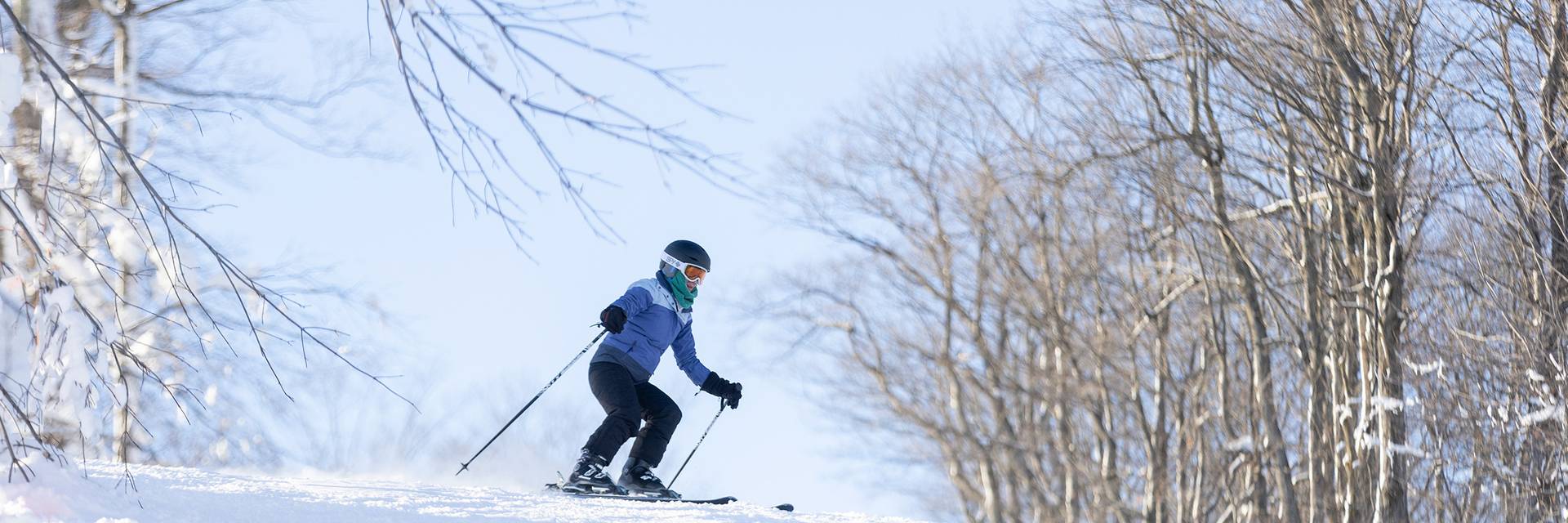 A woman skiing at The Highlands