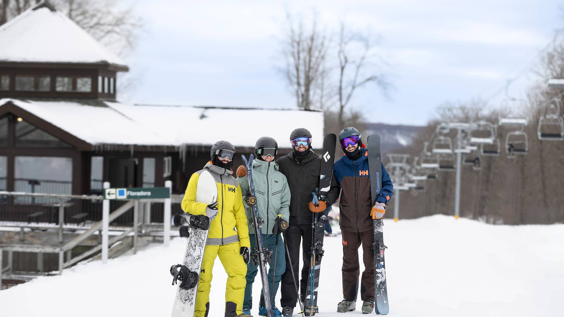 A group of men posing in snow gear