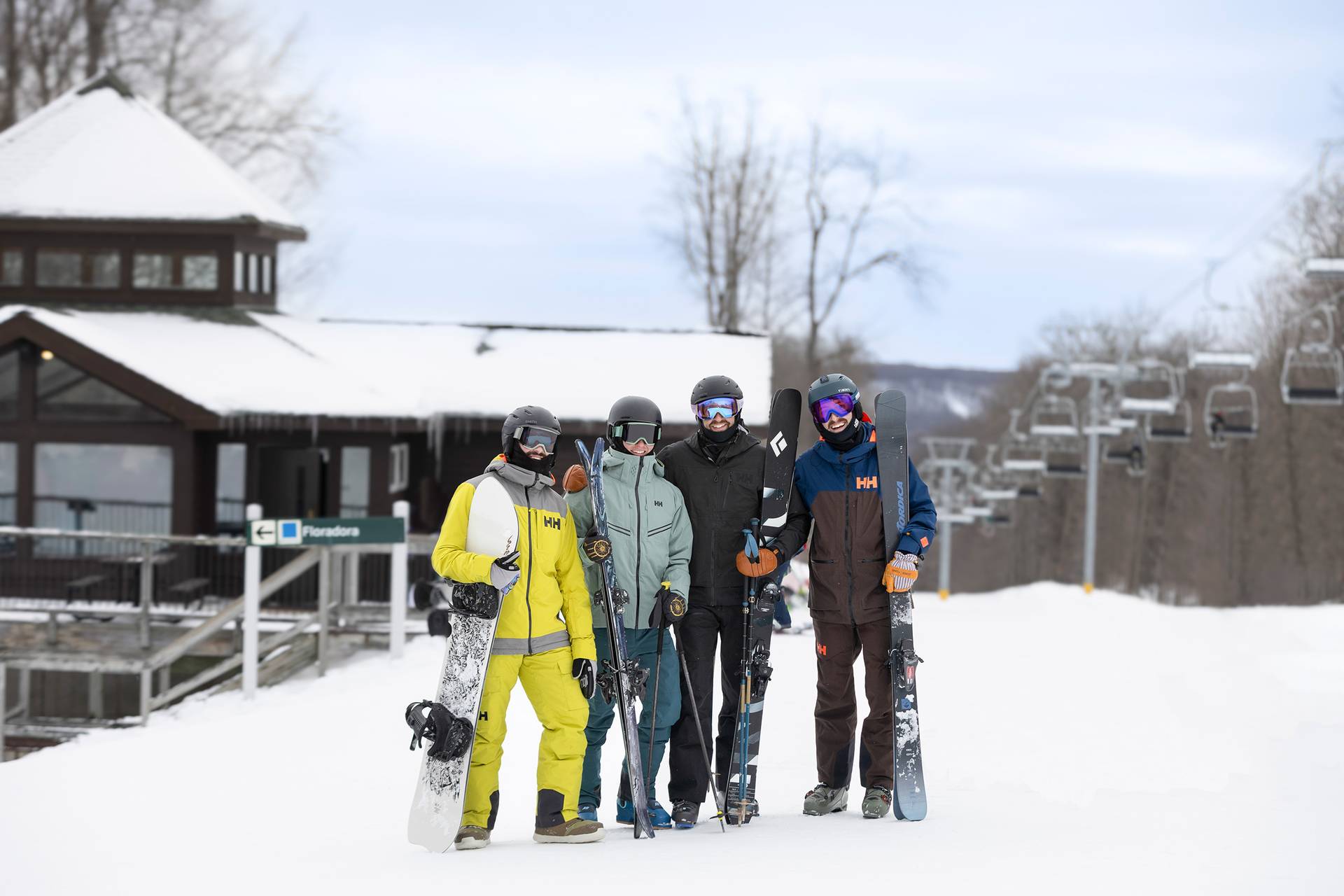 A group of men posing in snow gear