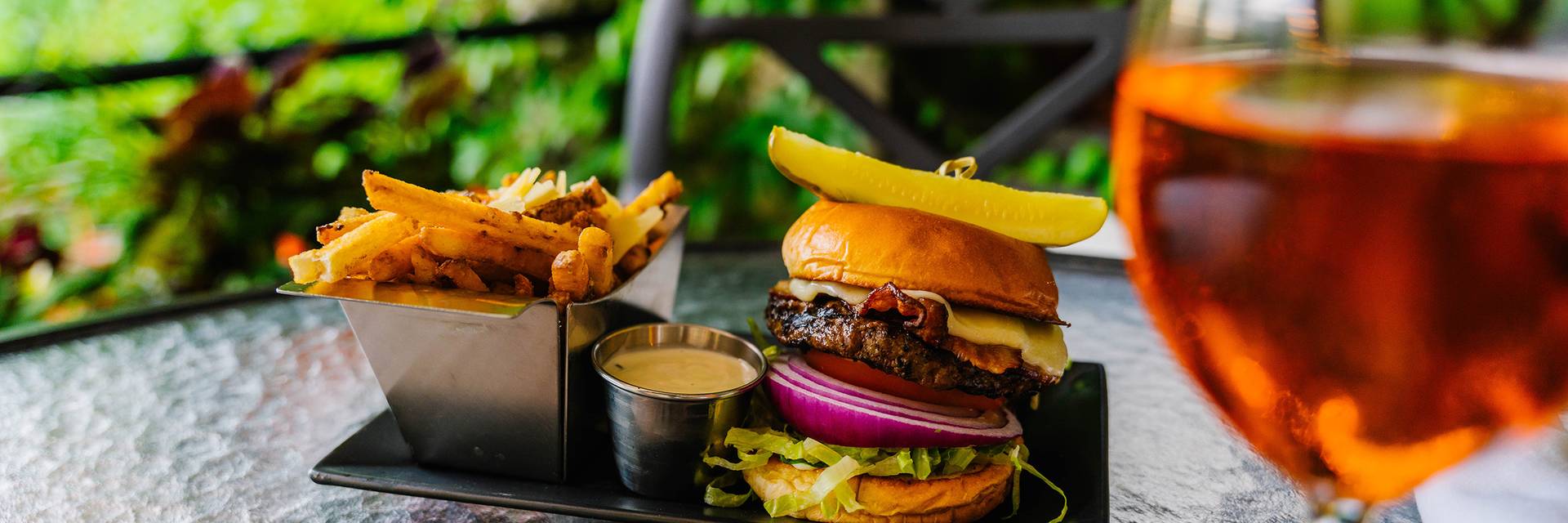 A burger at Slopeside Lounge with fries at The Highlands