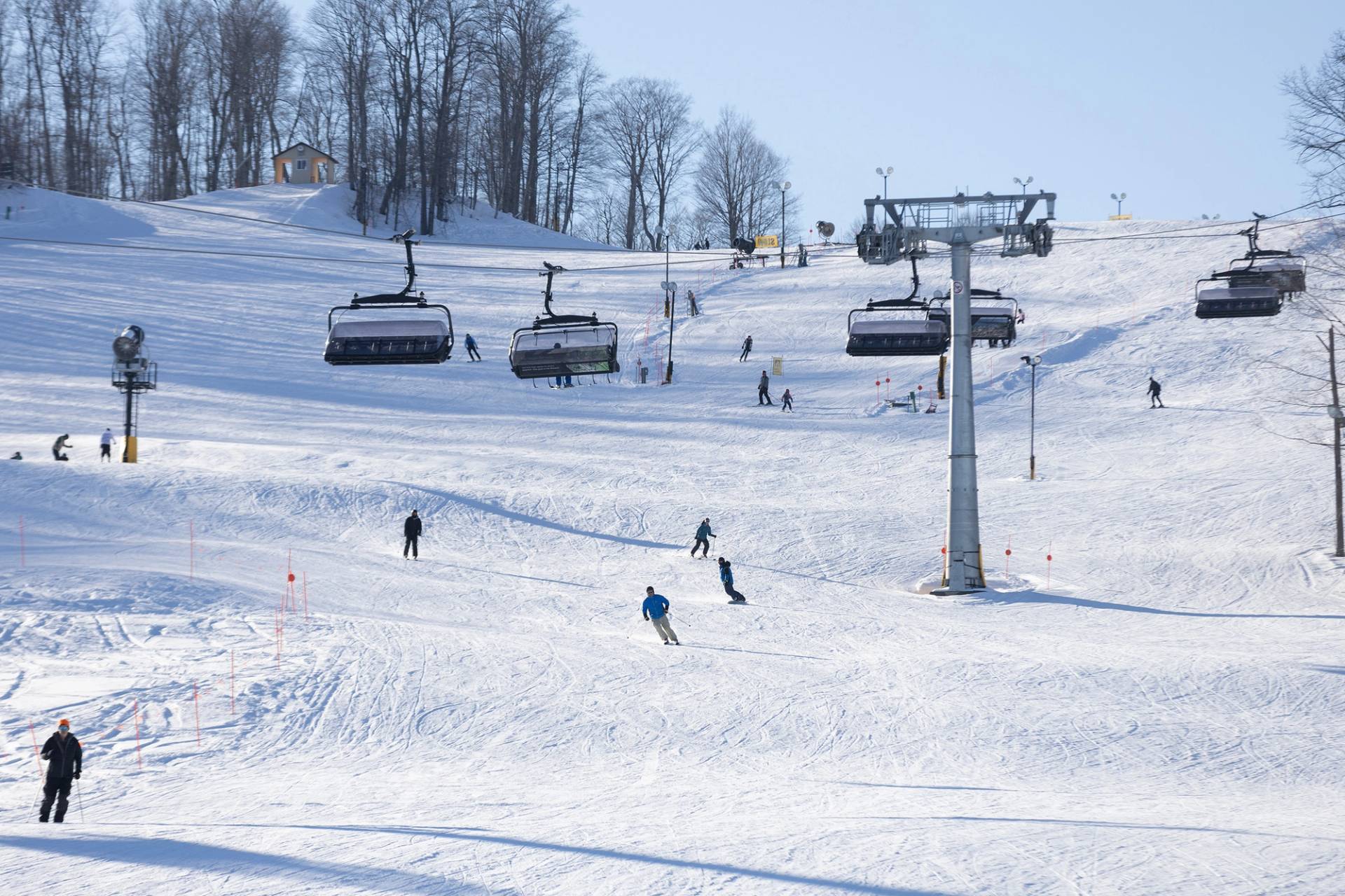 A drone shot of the Camelot 6 chairlift and skiers