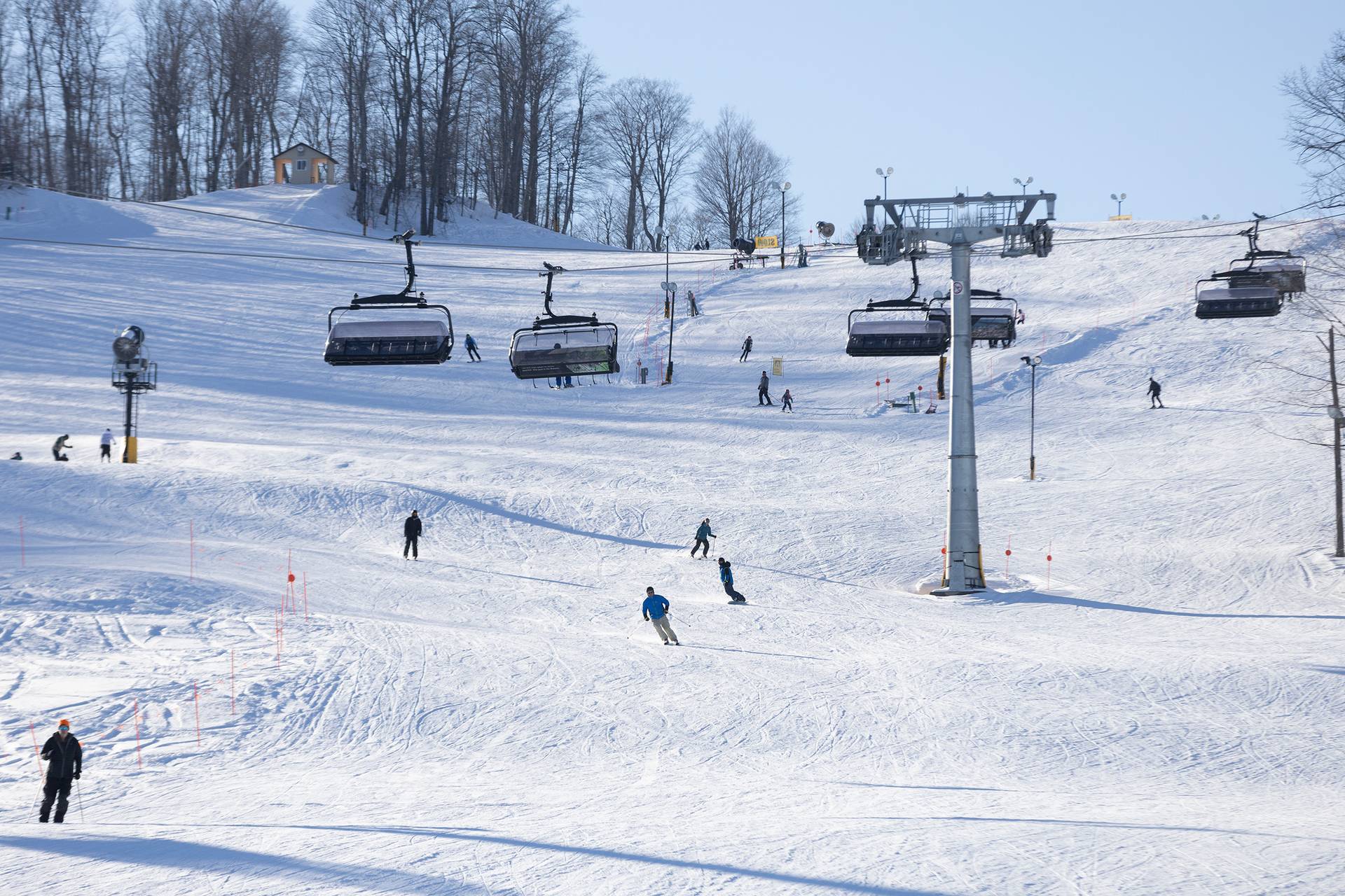 A drone shot of the Camelot 6 chairlift and skiers