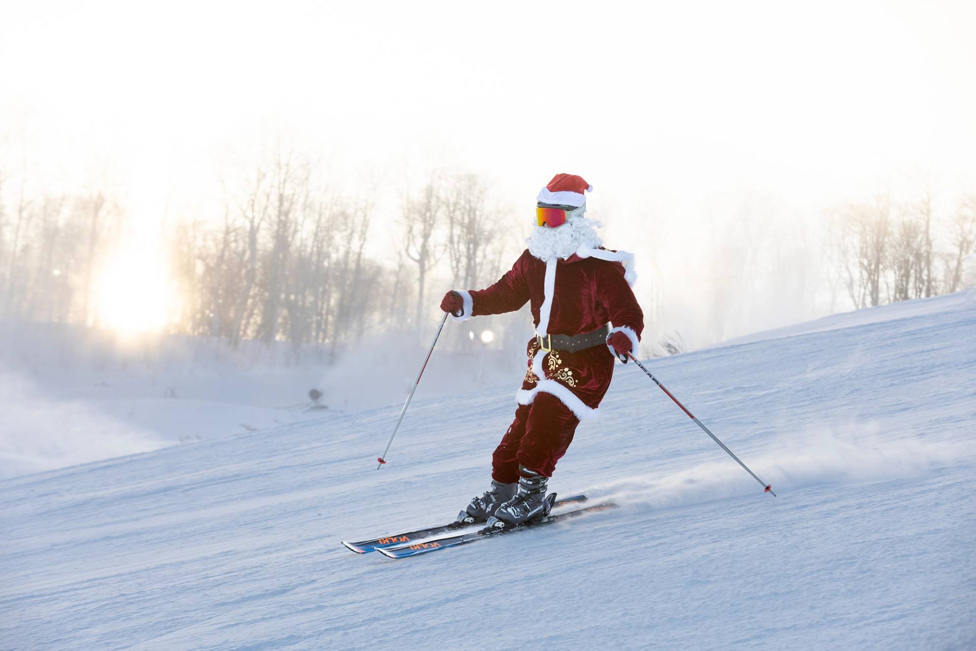 A skier dressed in a Santa suit