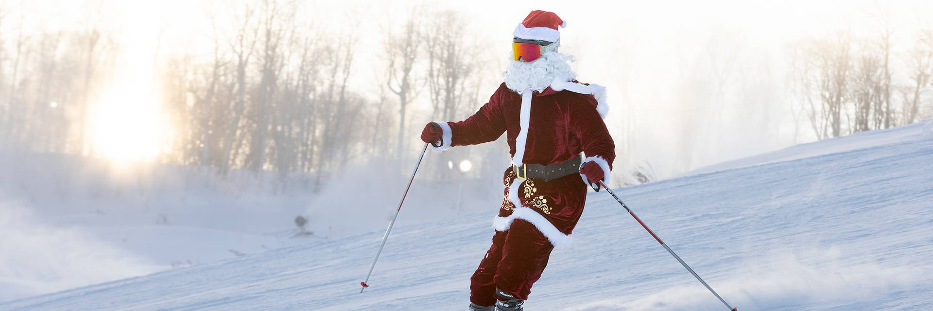 A skier dressed in a Santa suit