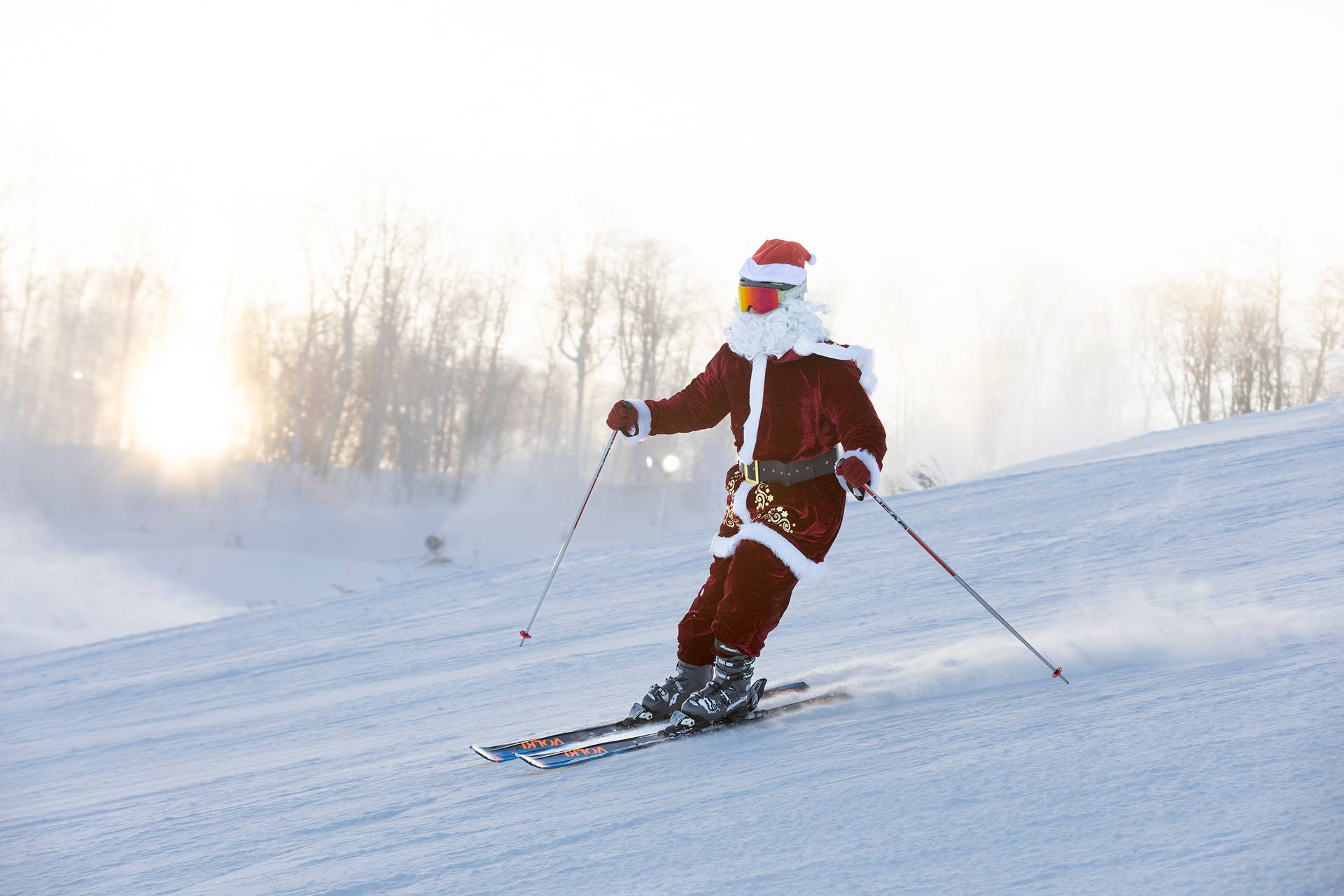 A skier dressed in a Santa suit