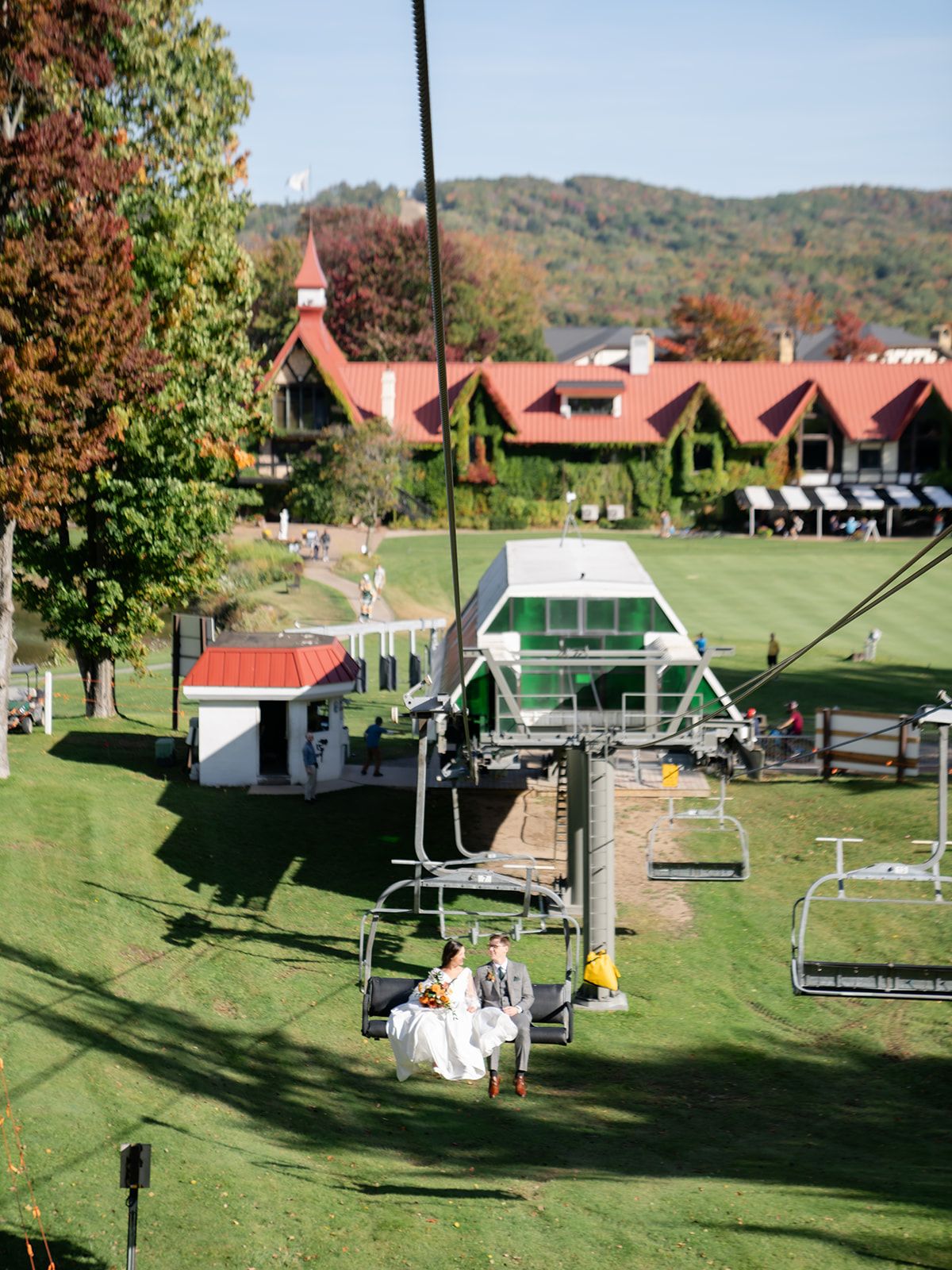 Bride and groom on a chairlift ride at The Highlands