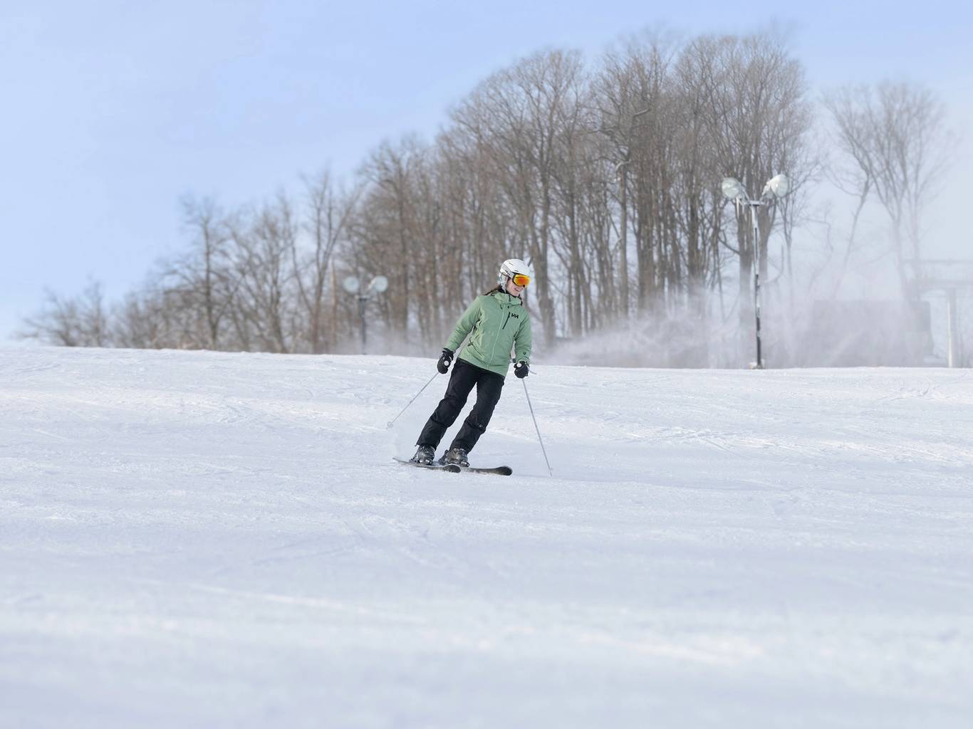 A family posing in the Camelot 6 chairlift at The Highlands