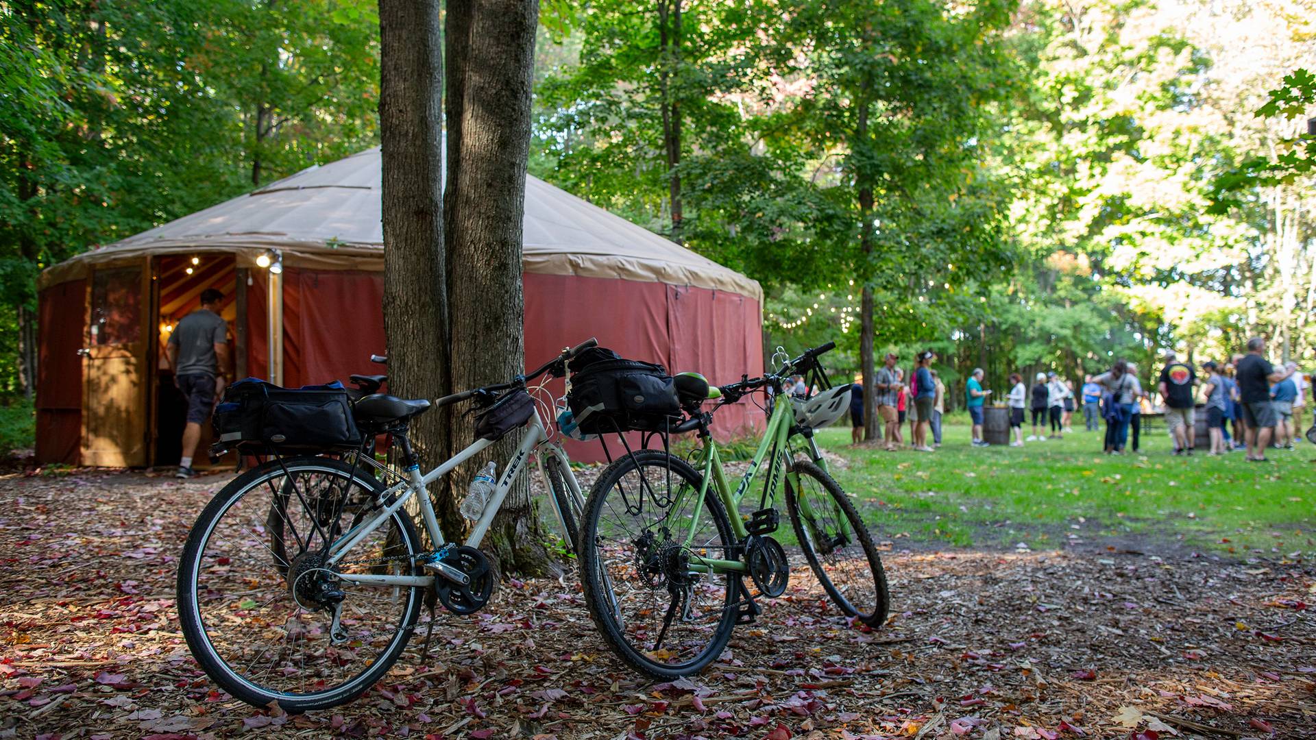 A group of bikers enjoying a party at the yurt during Biketemberfest at The Highlands