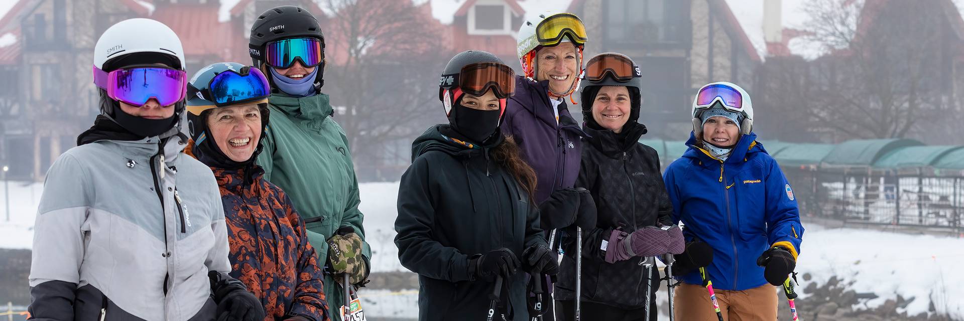 A group of women posing in ski gear