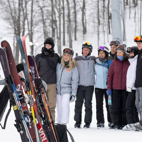 A group of people in snow gear posing