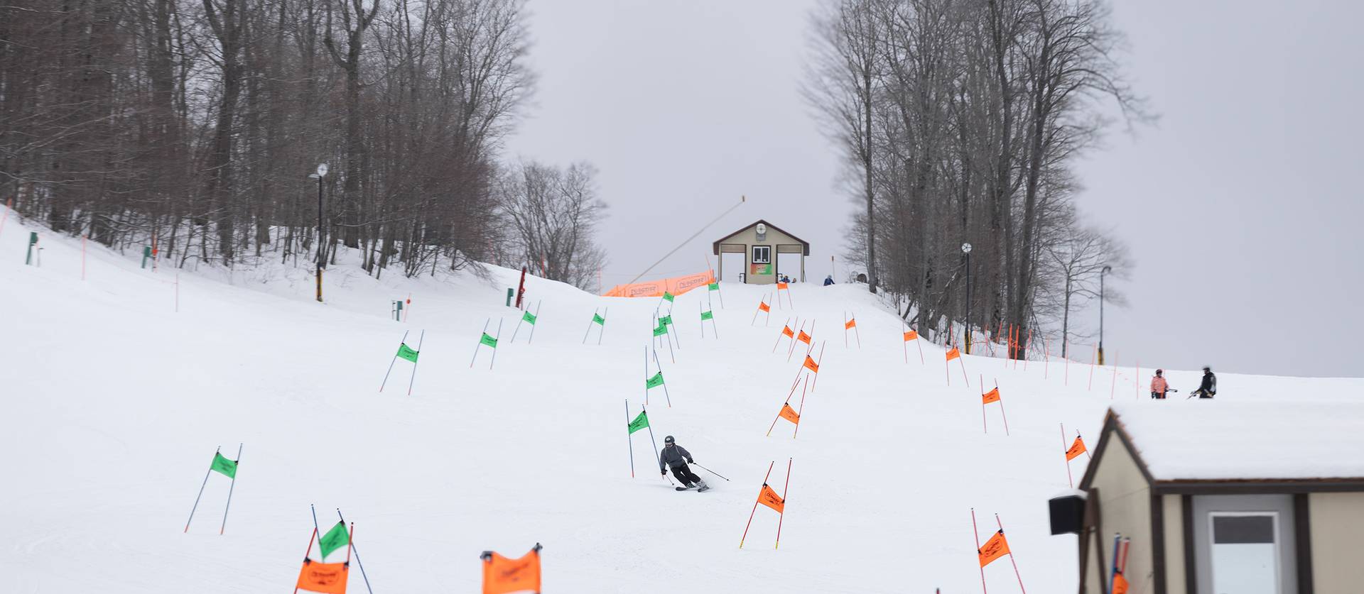 A skier racing on the NASTAR race course