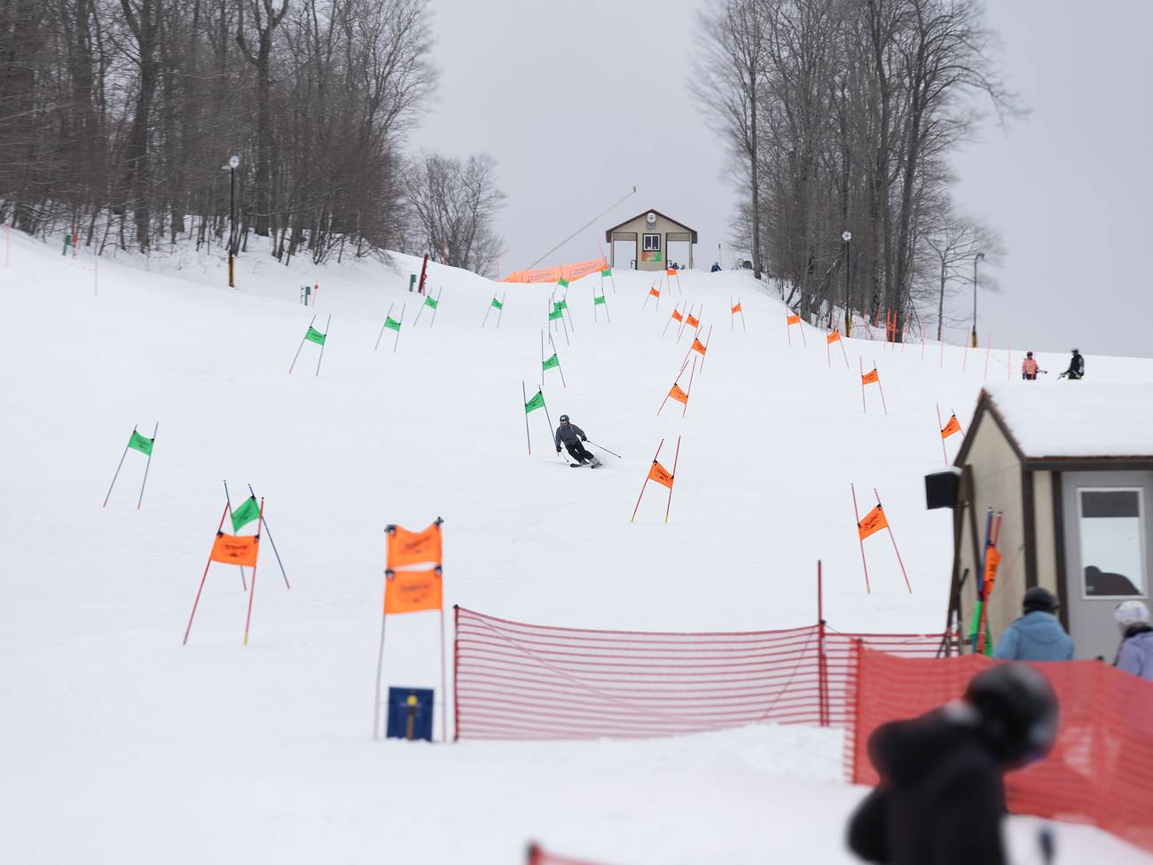 A skier racing on the NASTAR race course
