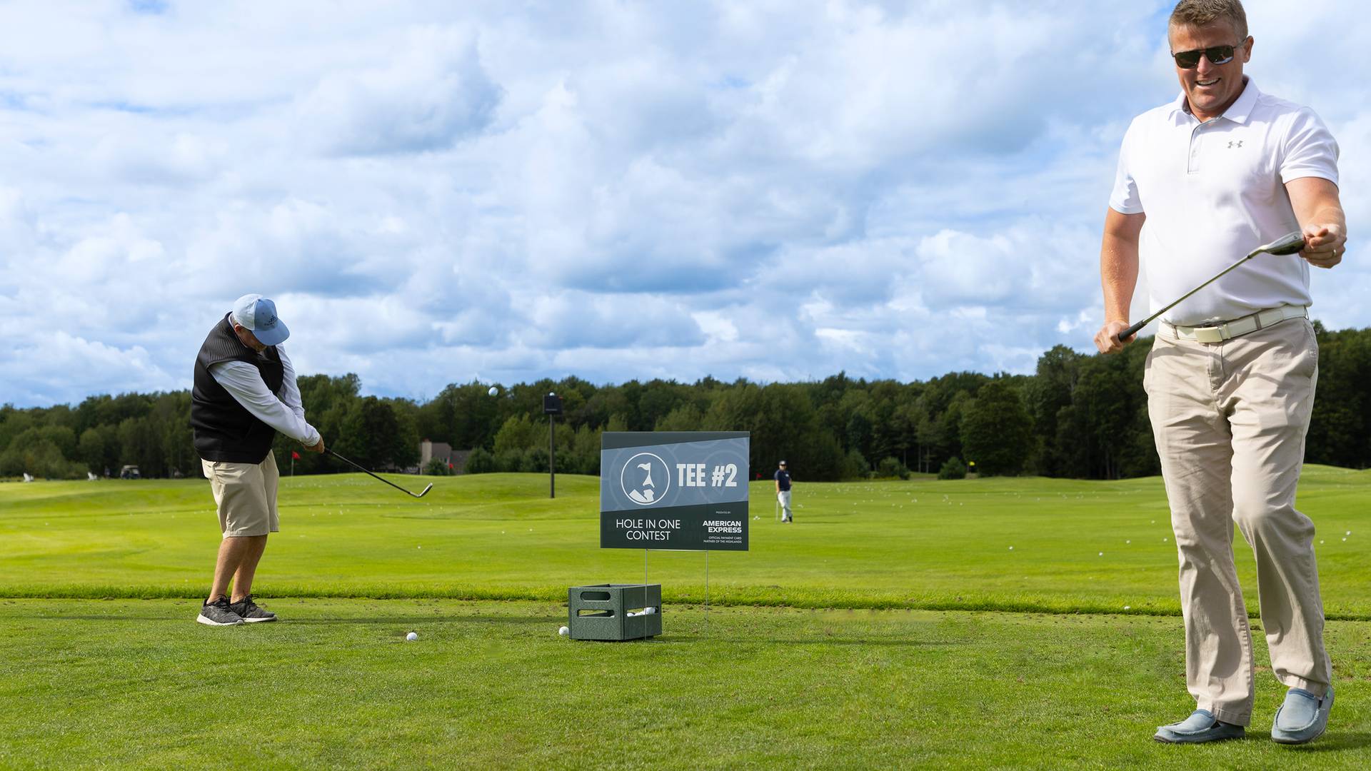 Two men with golf clubs