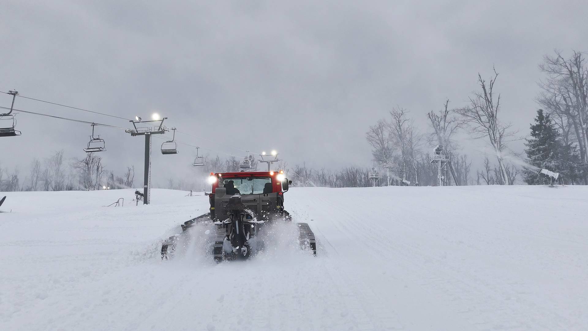 Drone shot of a groomer on the slopes