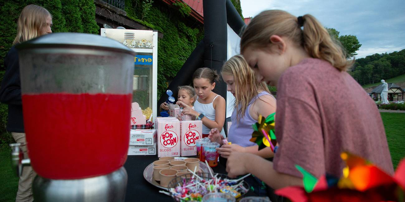 A group of children getting snacks at The Highlands