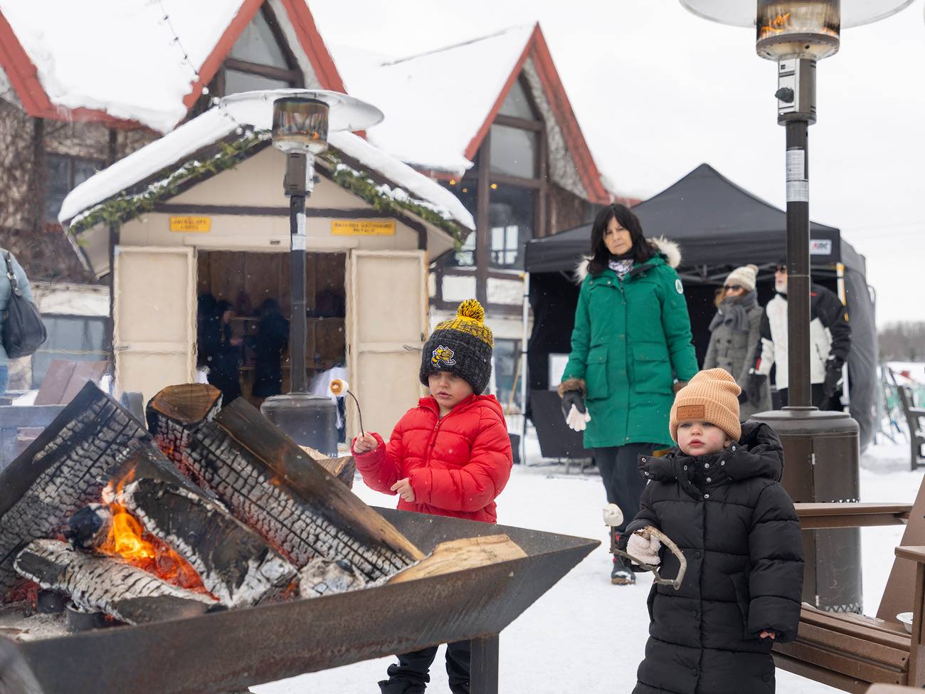 Two kids roasting smore's in winter