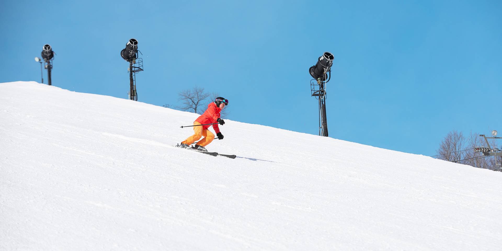 A woman skiing at The Highlands