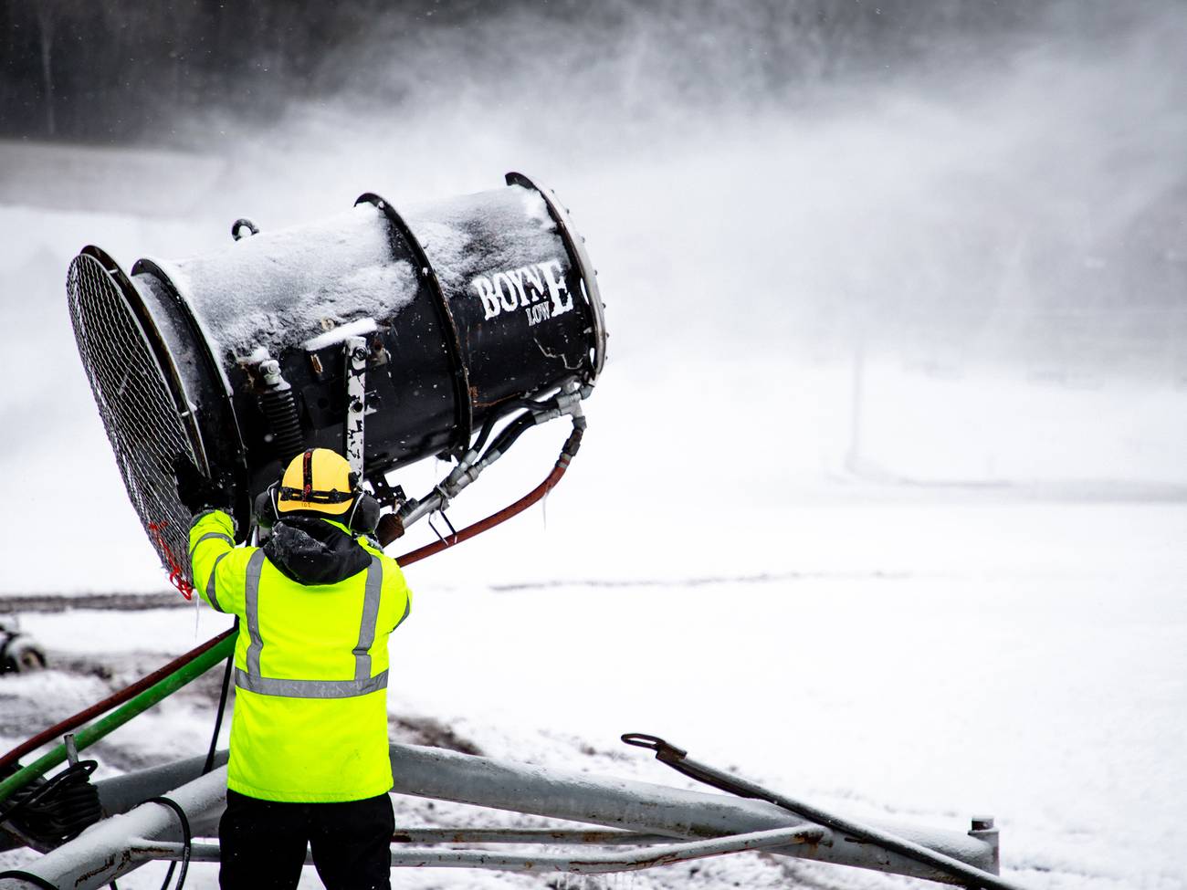 A snowmaker working on a snow gun