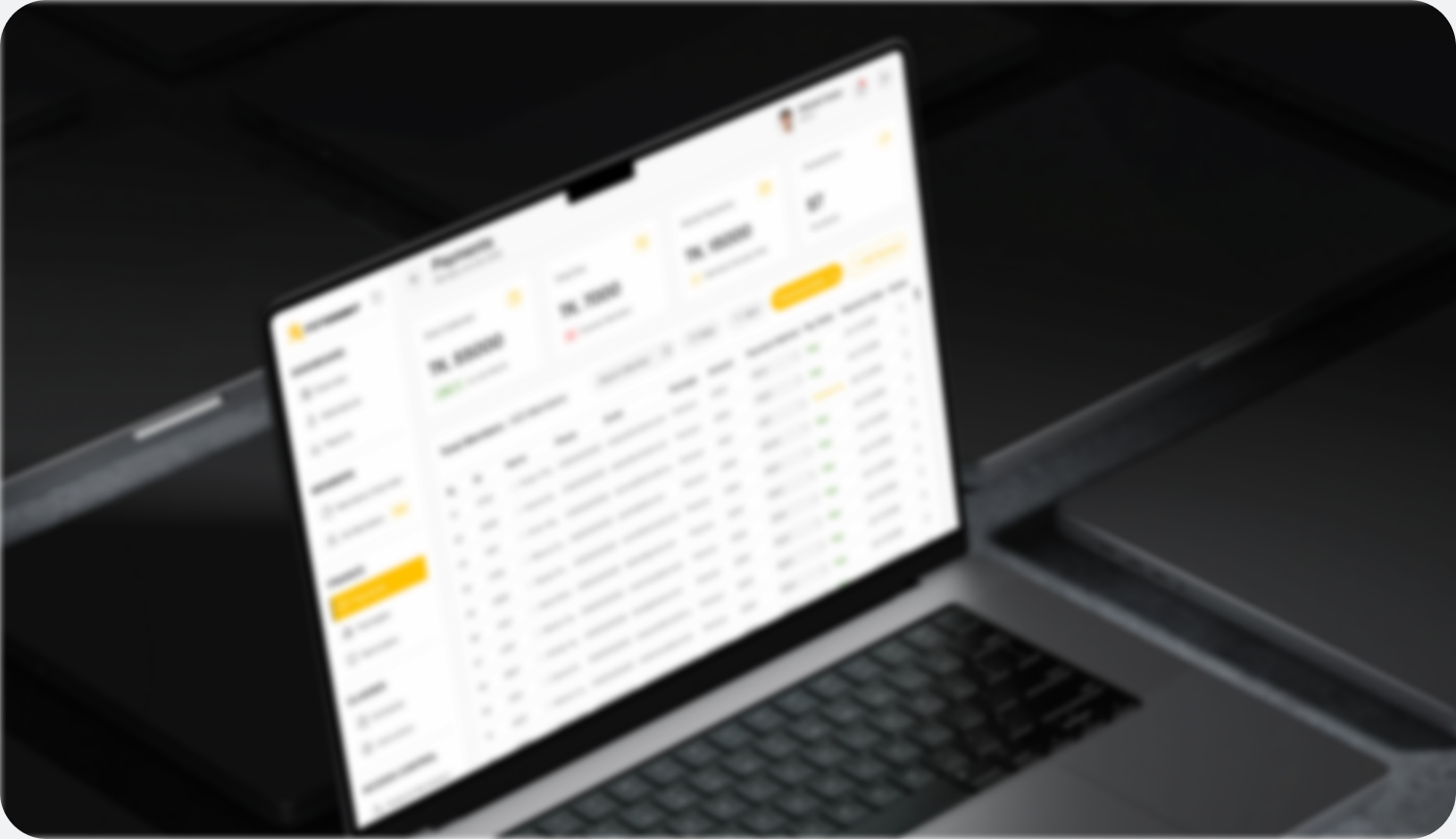 FitSSort's payments table open on a laptop on a dark desk.