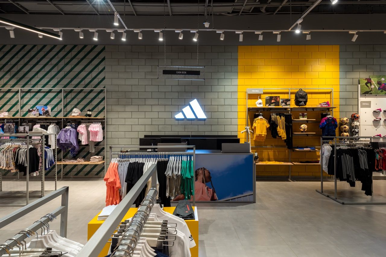 A wide-angle, exterior view of the **Lloyd's Building** in London, showcasing its distinctive inside-out architecture with exposed pipes, ducts, and service elements on the facade. The building stands tall against the skyline, reflecting the surrounding urban environment.
