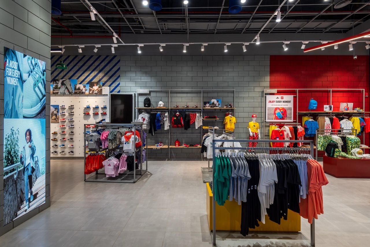 A wide-angle, exterior view of the **Lloyd's Building** in London, showcasing its distinctive inside-out architecture with exposed pipes, ducts, and service elements on the facade. The building stands tall against the skyline, reflecting the surrounding urban environment.
