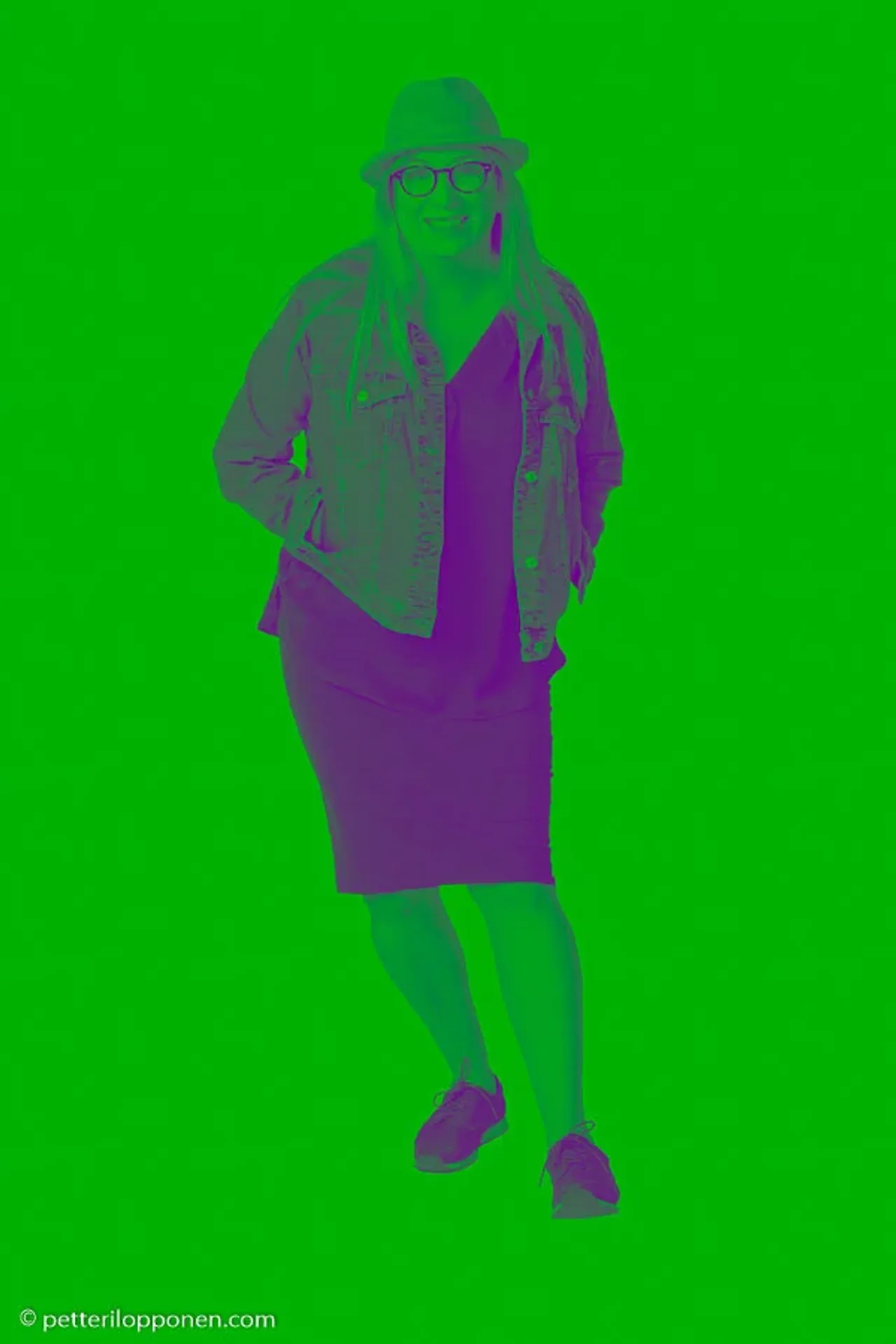 A green-toned silhouette of a speaker.
