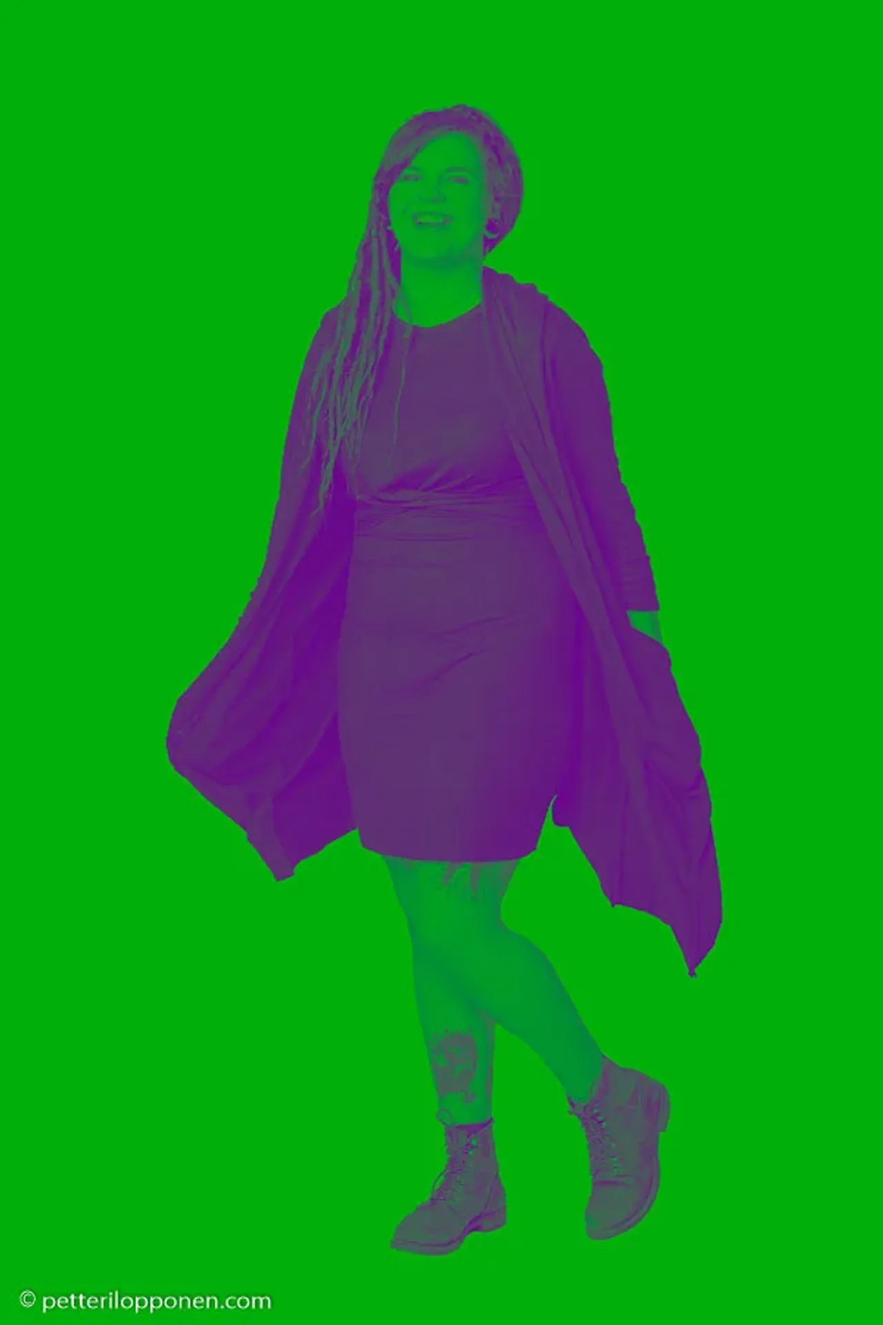 A purple figure cutout against a green background.