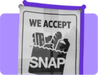 A sign that would go on a grocery store window that says "we accept SNAP"