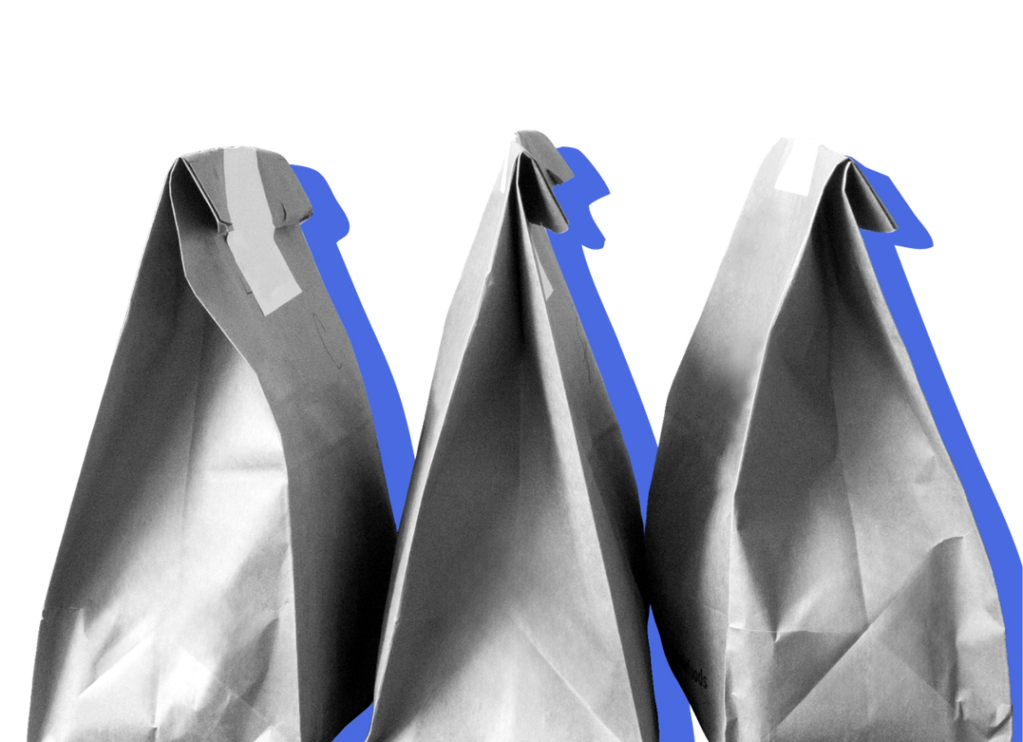 Takeout bags against a blue background.