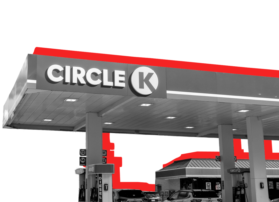 The exterior of a Circle K location pictured against a red background.