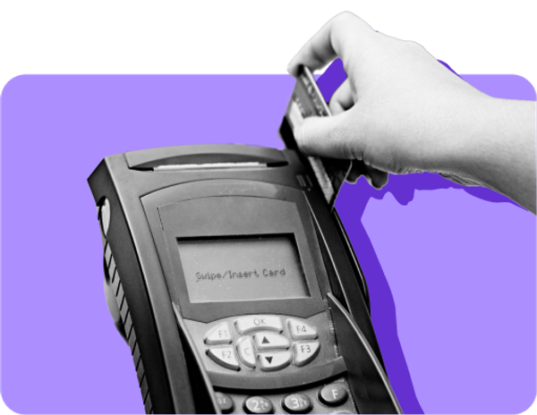 A hand swipes an EBT card on a card reader against a purple background