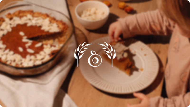 A child eating a slice of pie at a Thanksgiving table, with the Propel logo
