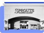 An image showing the exterior entrance of a Sprouts store against a blue background