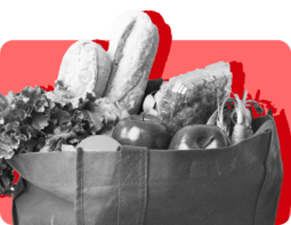 Bag with fresh produce including bread, tomato, carrots